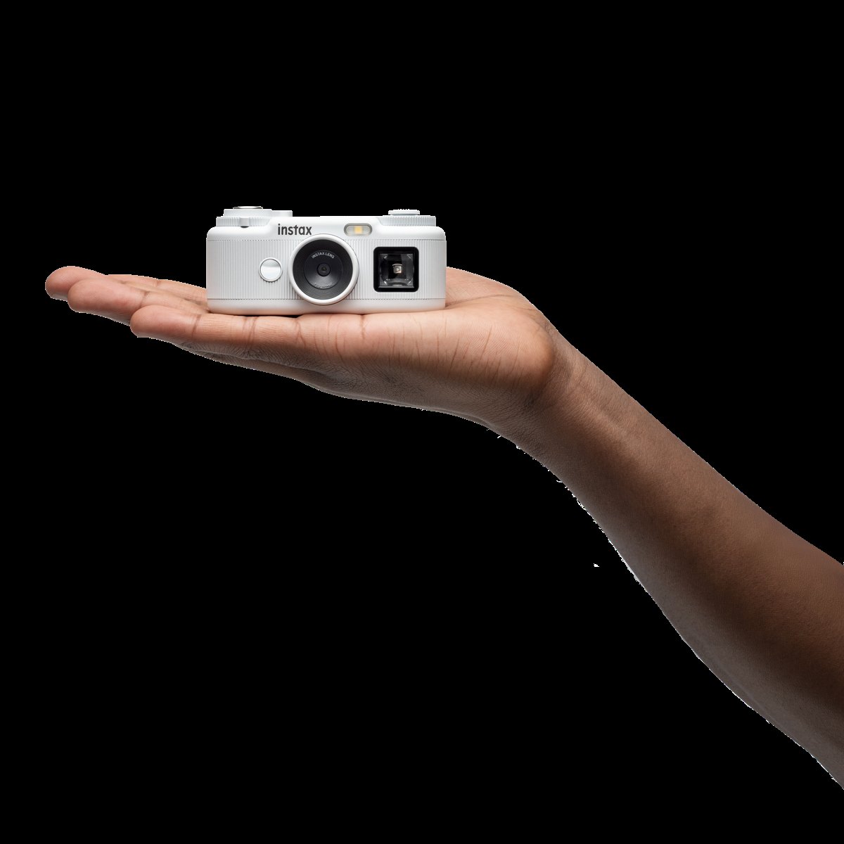 260528 instax Pal 2   Promotional images   17 Pal 2 in the palm of hand   White 2285
